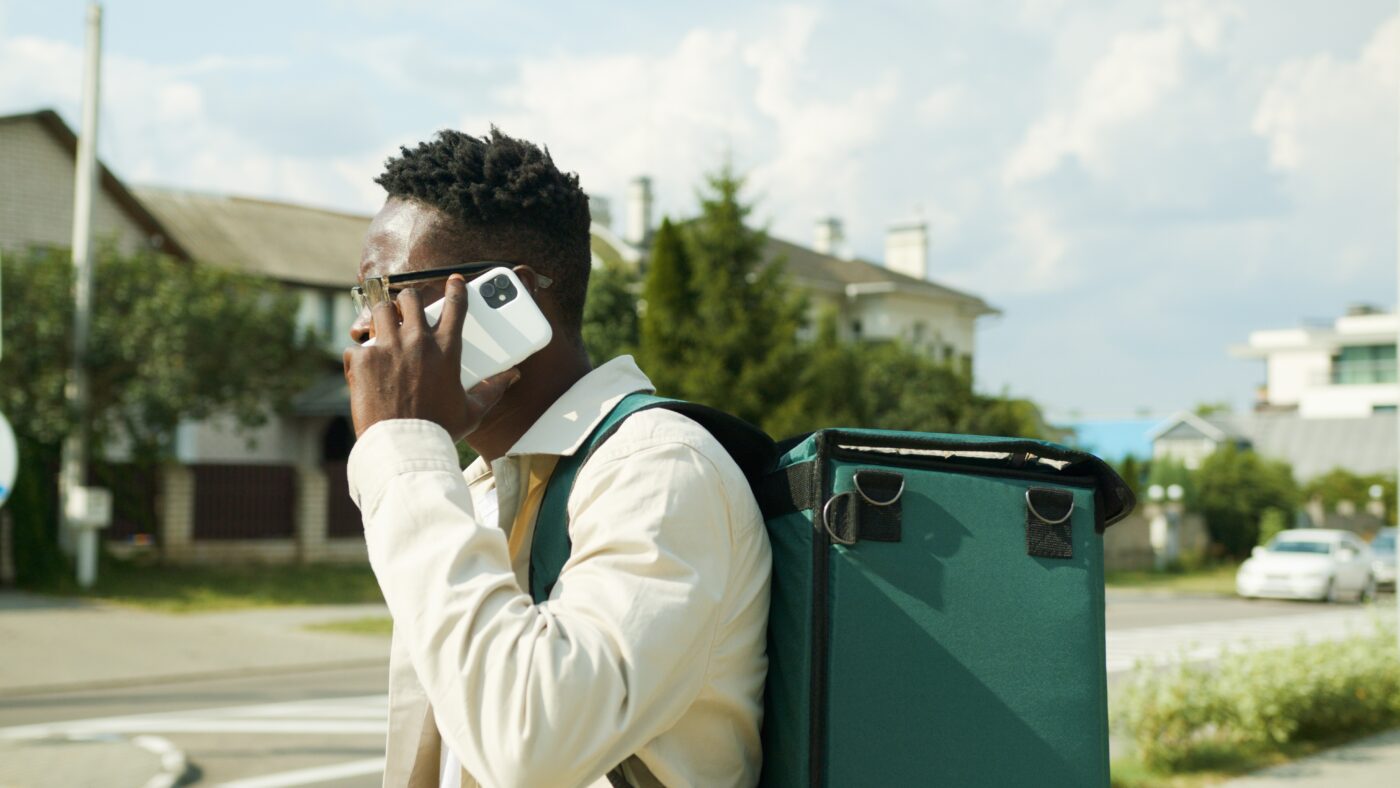 Food delivery rider on a call