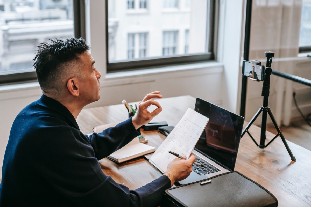 Man sitting in front of a laptop